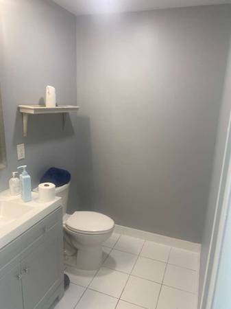 Completed bathroom remodel with new vanity and tile floor