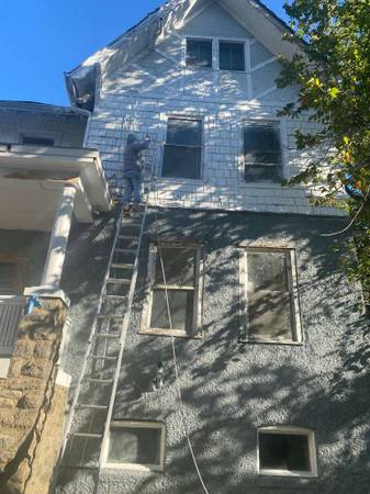Exterior repaint and siding work in progress on a Washington, DC home